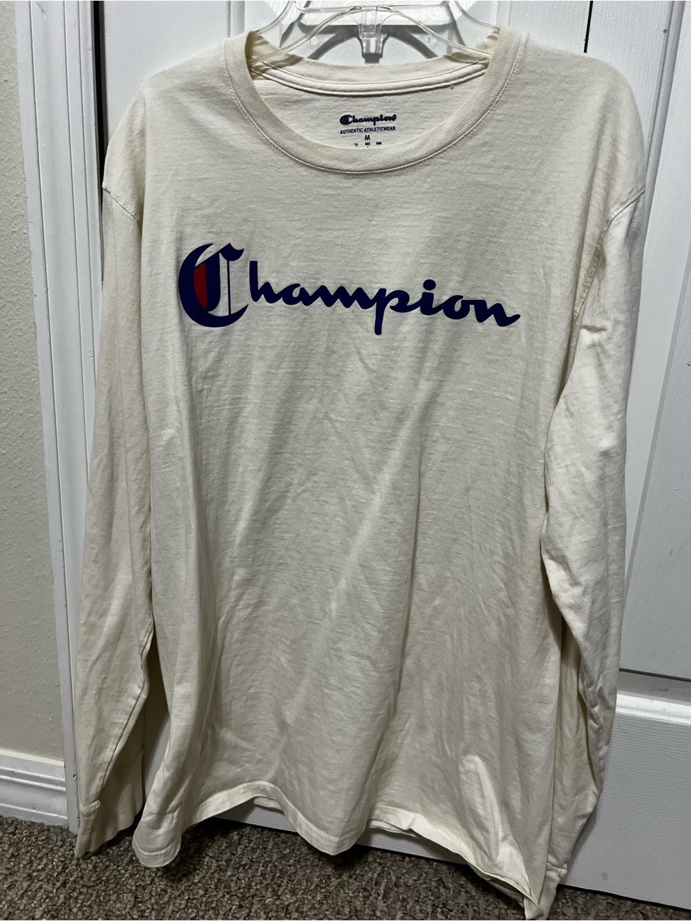Cream long sleeve Champion Athleticwear. Size M